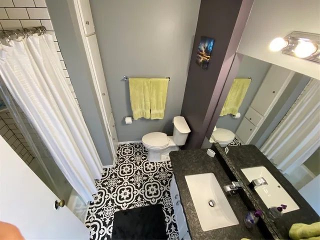 a living room with a table and chairs