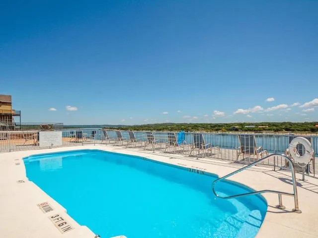 a view of a swimming pool with a patio