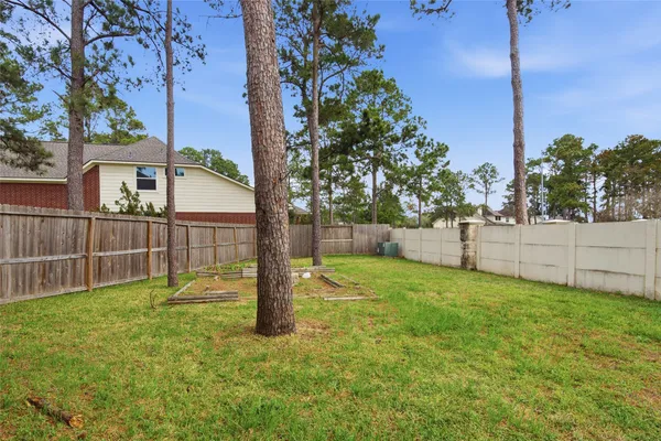 a view of backyard with green space