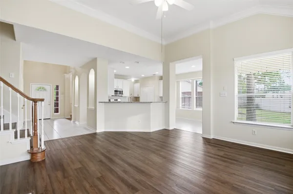 a view of large open kitchen with wooden floor and a kitchen
