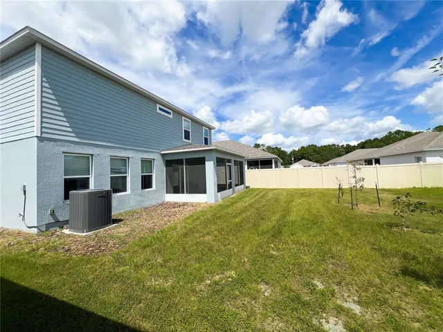 a front view of house with yard and entertaining space