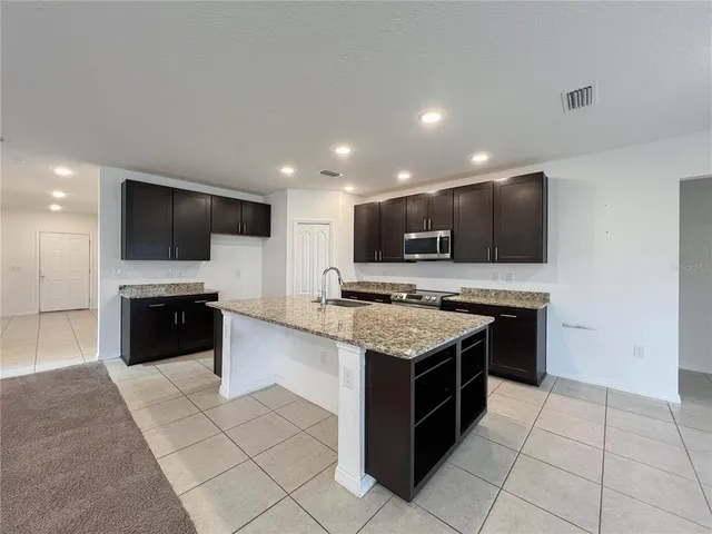 a kitchen with a stove and a microwave