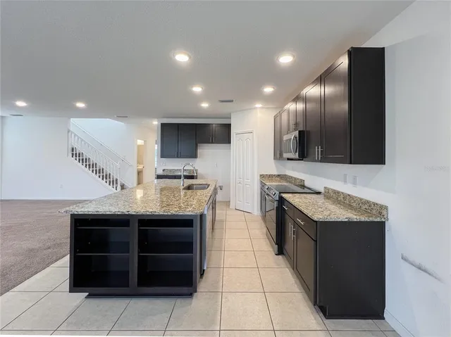 a kitchen with a sink and cabinets