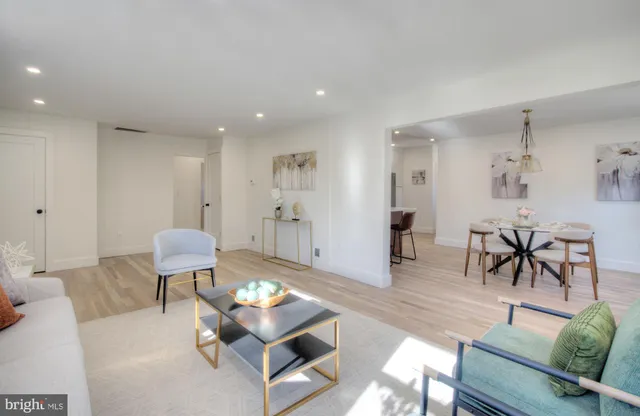 a living room with furniture and a table