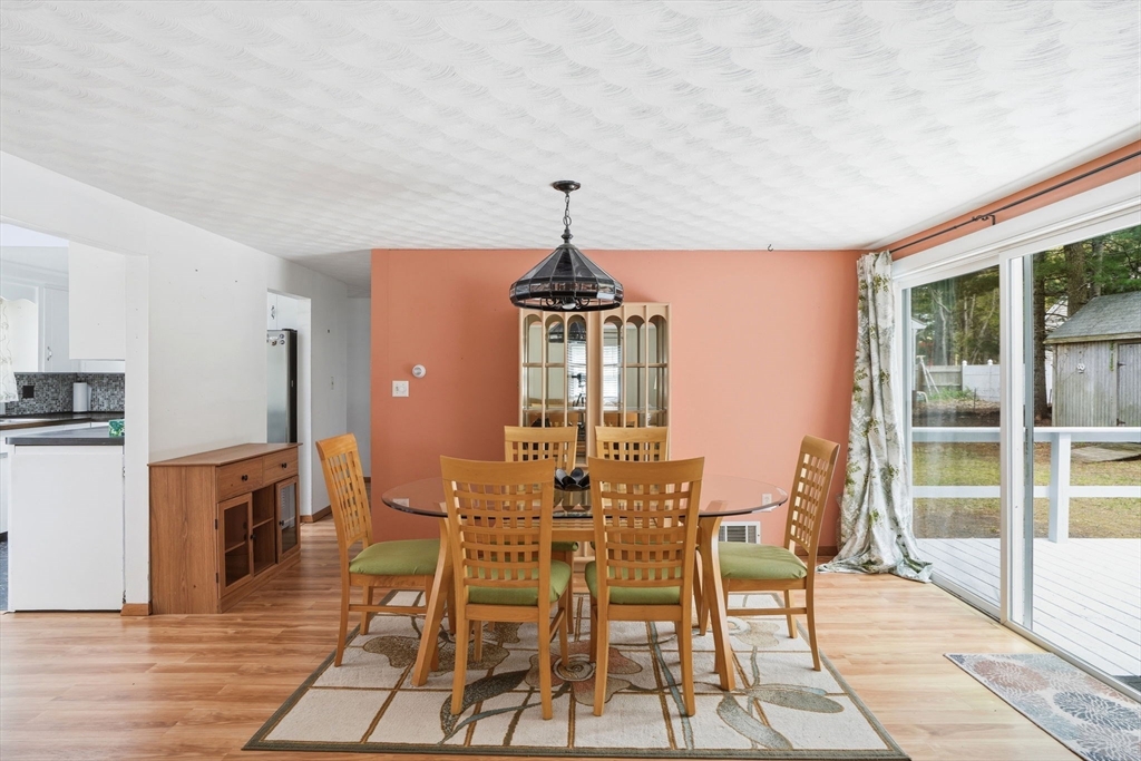 94 Edgewater Drive Wareham, MA 02571 - Photo 26 of 37 a view of a dining room with furniture window and wooden floor