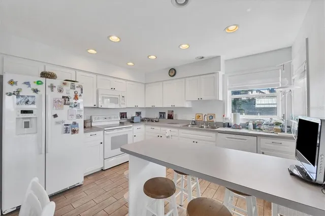 a kitchen with stainless steel appliances granite countertop a sink and cabinets