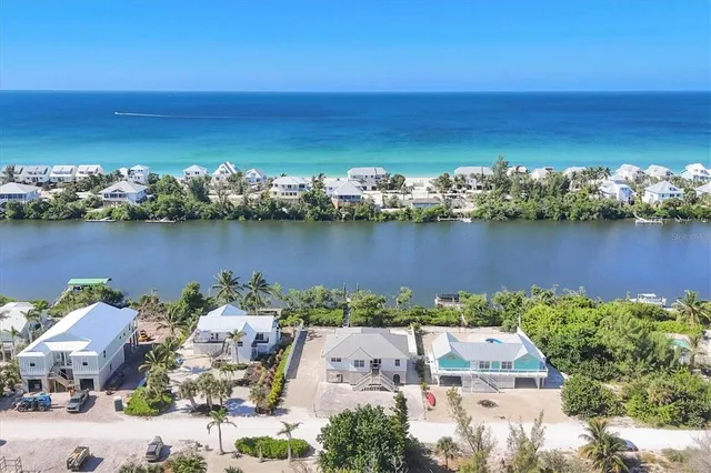 an aerial view of a house with a lake view