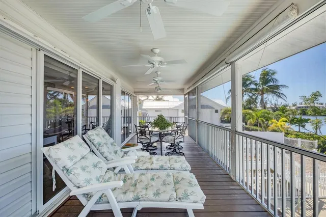 a view of a patio with a table chairs and a potted plant