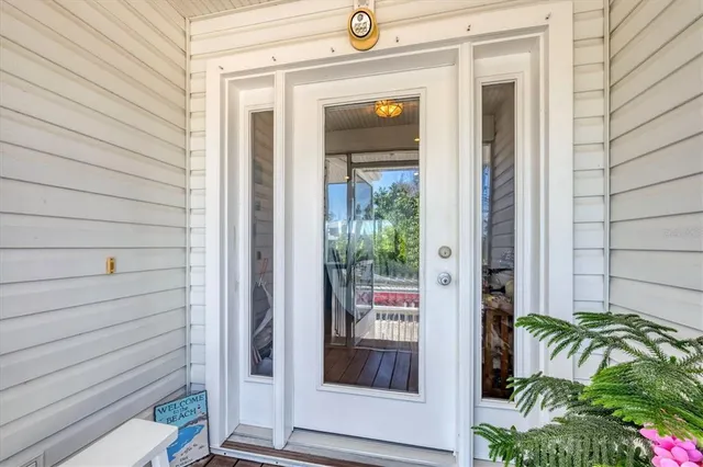 a view of a door and chair in the balcony