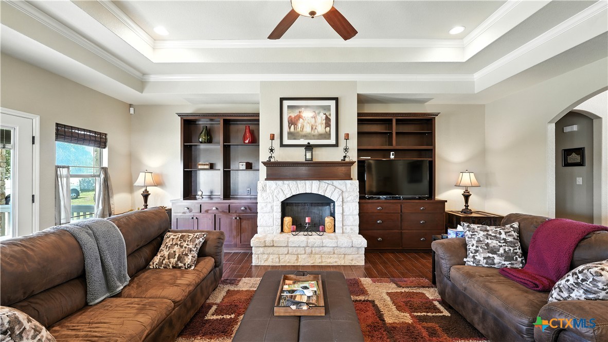 121 Carrizo Ridge Floresville, TX 78114 - Photo 12 of 43 a living room with furniture and a fireplace