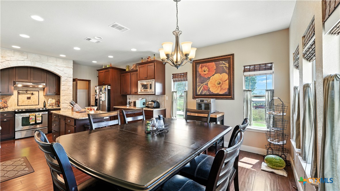 121 Carrizo Ridge Floresville, TX 78114 - Photo 20 of 43 a view of a dining room with furniture window and wooden floor