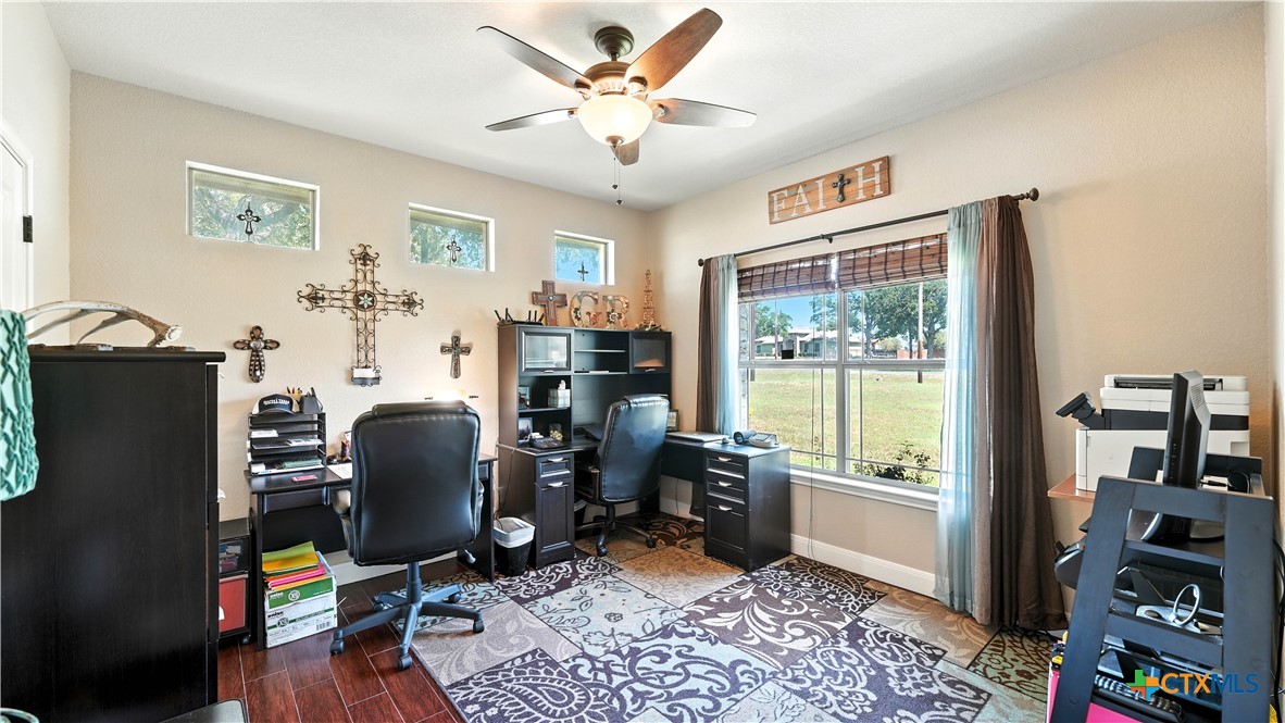 121 Carrizo Ridge Floresville, TX 78114 - Photo 32 of 43 a view of a workspace with furniture and a window