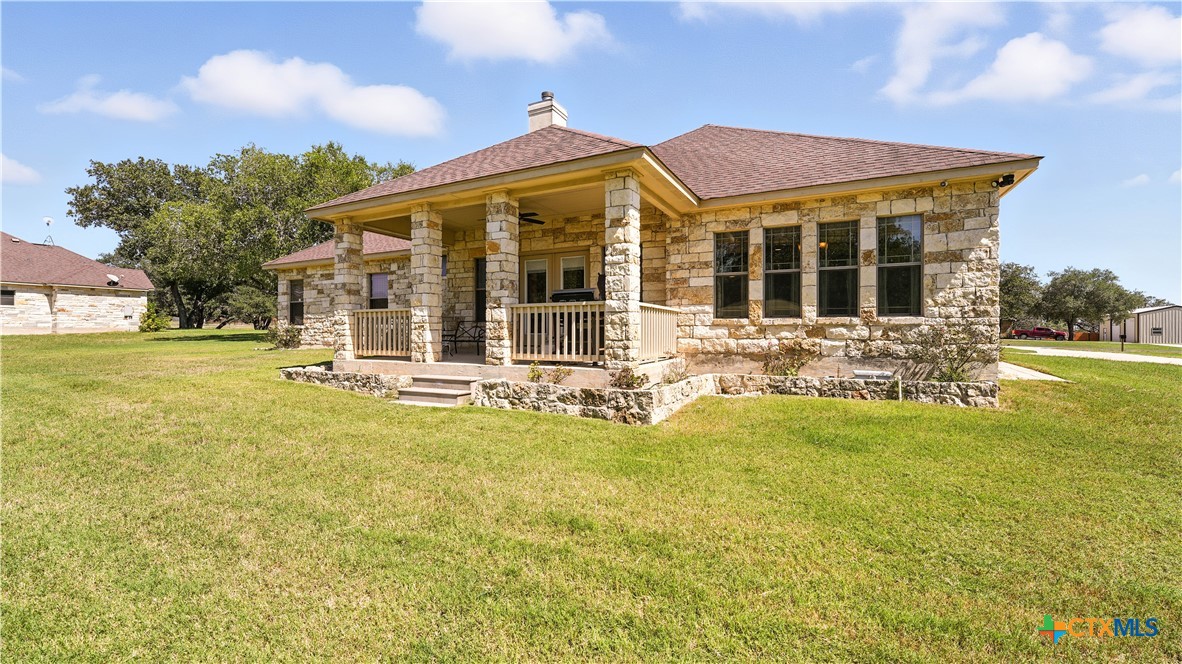 121 Carrizo Ridge Floresville, TX 78114 - Photo 9 of 43 a view of a house with swimming pool and a yard