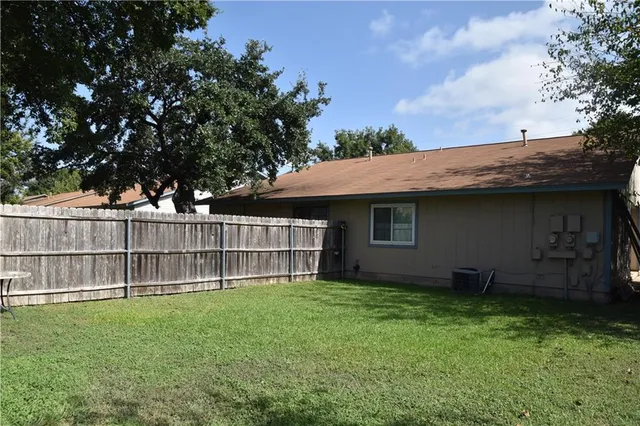 a backyard of a house with lots of green space