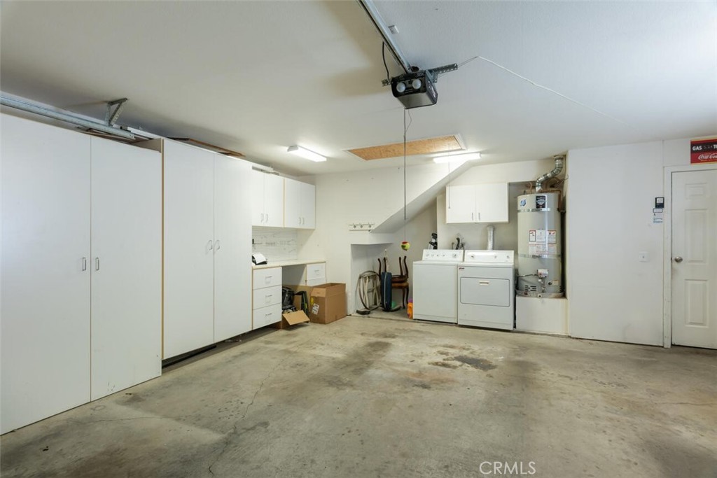 1718 Tecalote Drive, Unit 9 Fallbrook, CA 92028 - Photo 20 of 23 2 Car Garage cabinets - workbench and attic storage