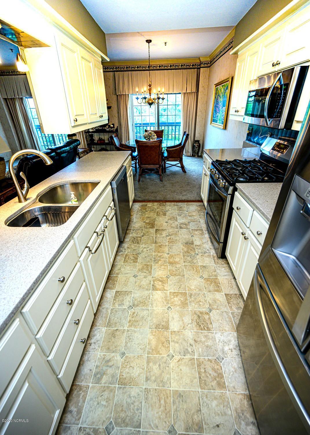 212 Middle Street, Unit 301 New Bern, NC 28560 - Photo 9 of 25 kitchen to dining room