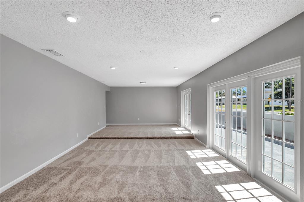 114 Barkfield Street Brandon, FL 33511 - Photo 11 of 59 a view of an empty room with floor to ceiling window