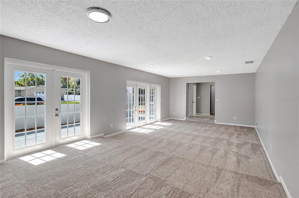 114 Barkfield Street Brandon, FL 33511 - Photo 13 of 59 an empty room with windows and entrance