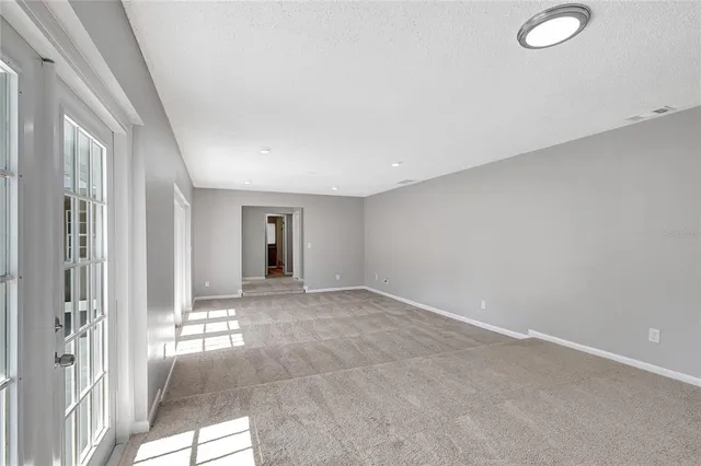 a kitchen with cabinets stainless steel appliances and sink