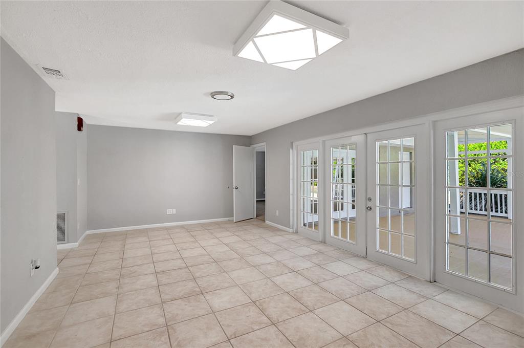 114 Barkfield Street Brandon, FL 33511 - Photo 22 of 59 a view of an empty room with glass door