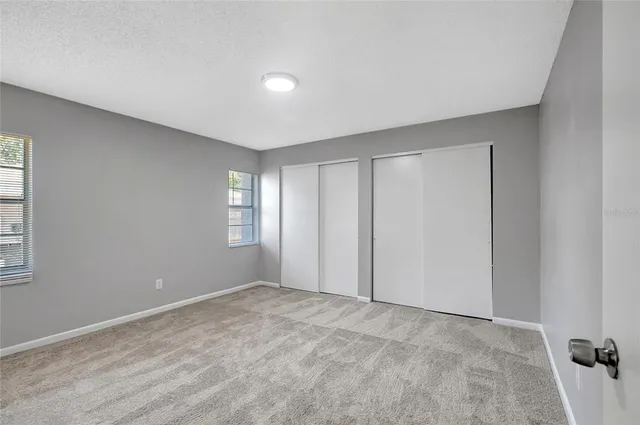 a view of a house with swimming pool in front of it