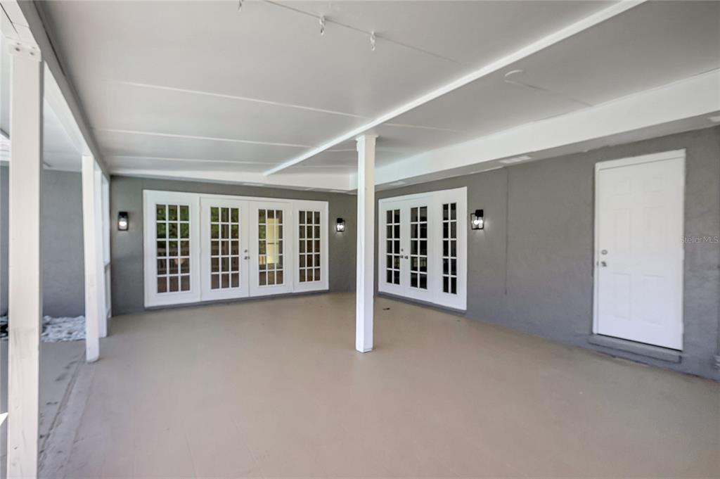 114 Barkfield Street Brandon, FL 33511 - Photo 49 of 59 an empty room with balcony and large window