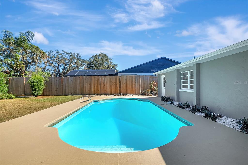 114 Barkfield Street Brandon, FL 33511 - Photo 51 of 59 a view of a house with swimming pool in front of it
