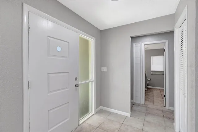 a view of an empty room with floor to ceiling window