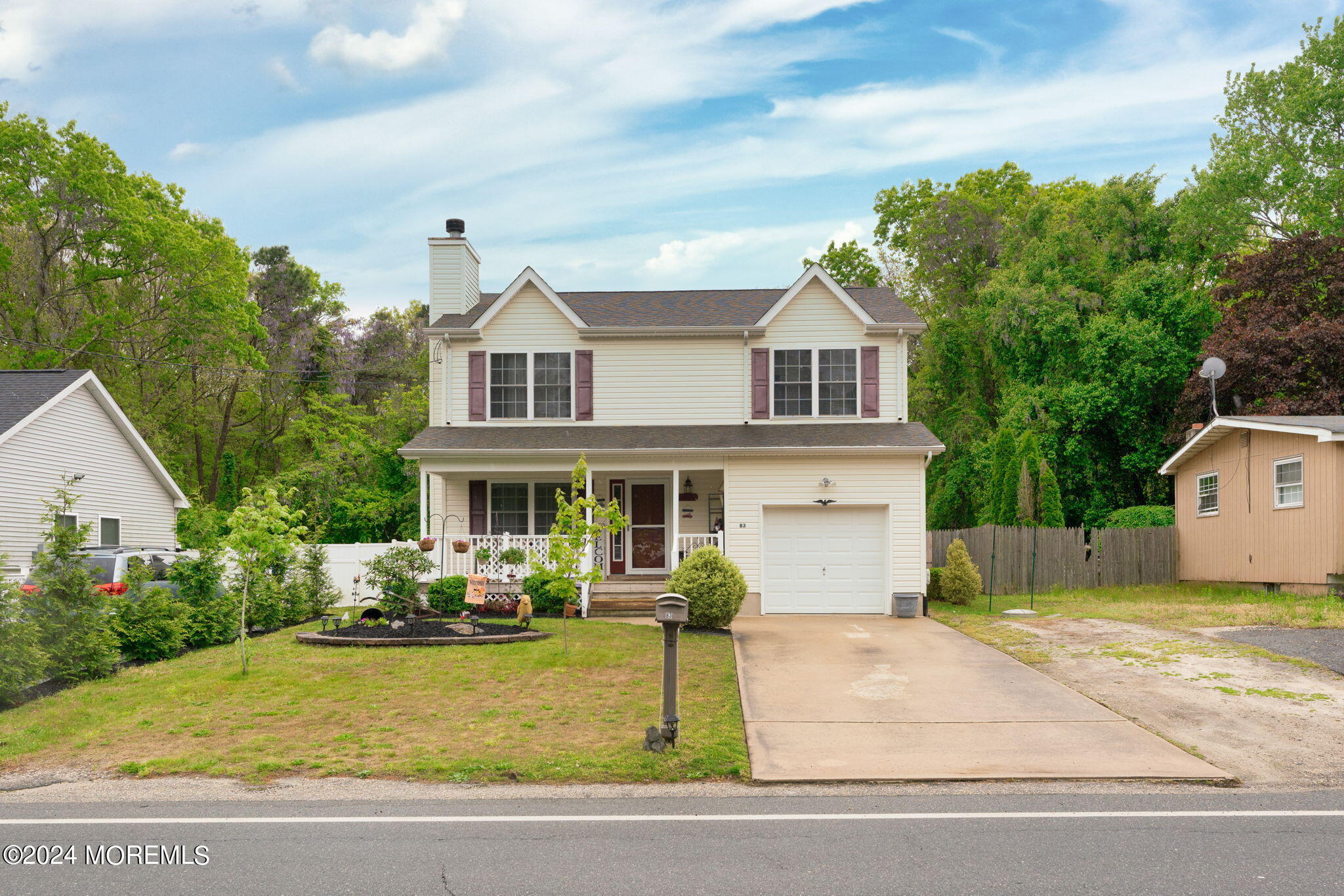83 Gunning River Road Barnegat, NJ 08005 - Photo 1 of 24 a front view of a house with garden