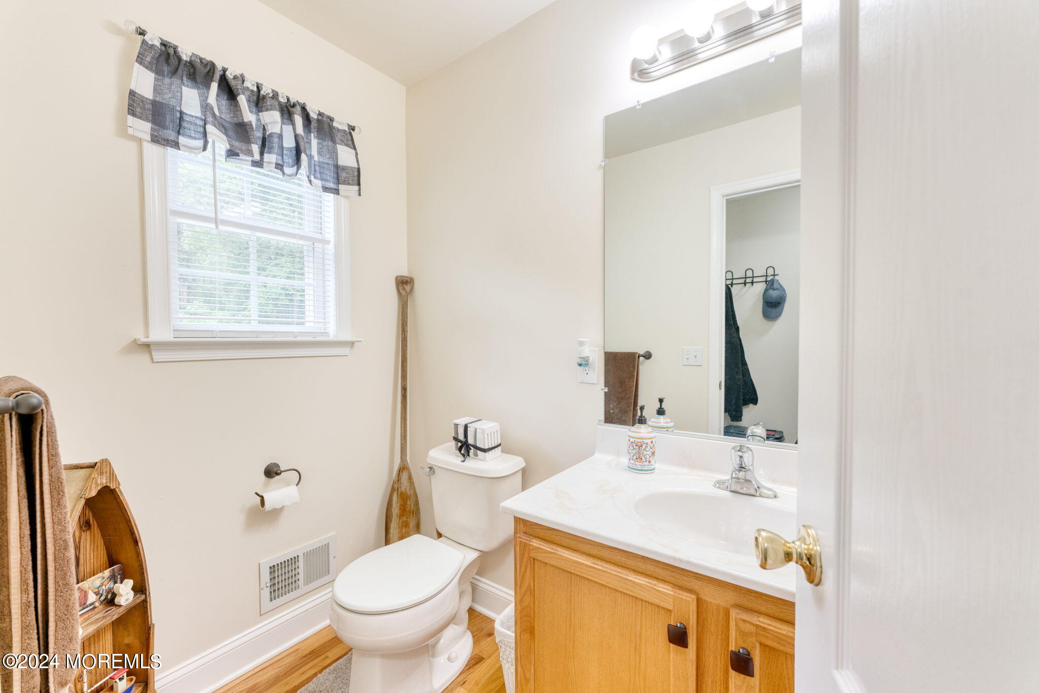 83 Gunning River Road Barnegat, NJ 08005 - Photo 11 of 24 a bathroom with a sink toilet and a mirror