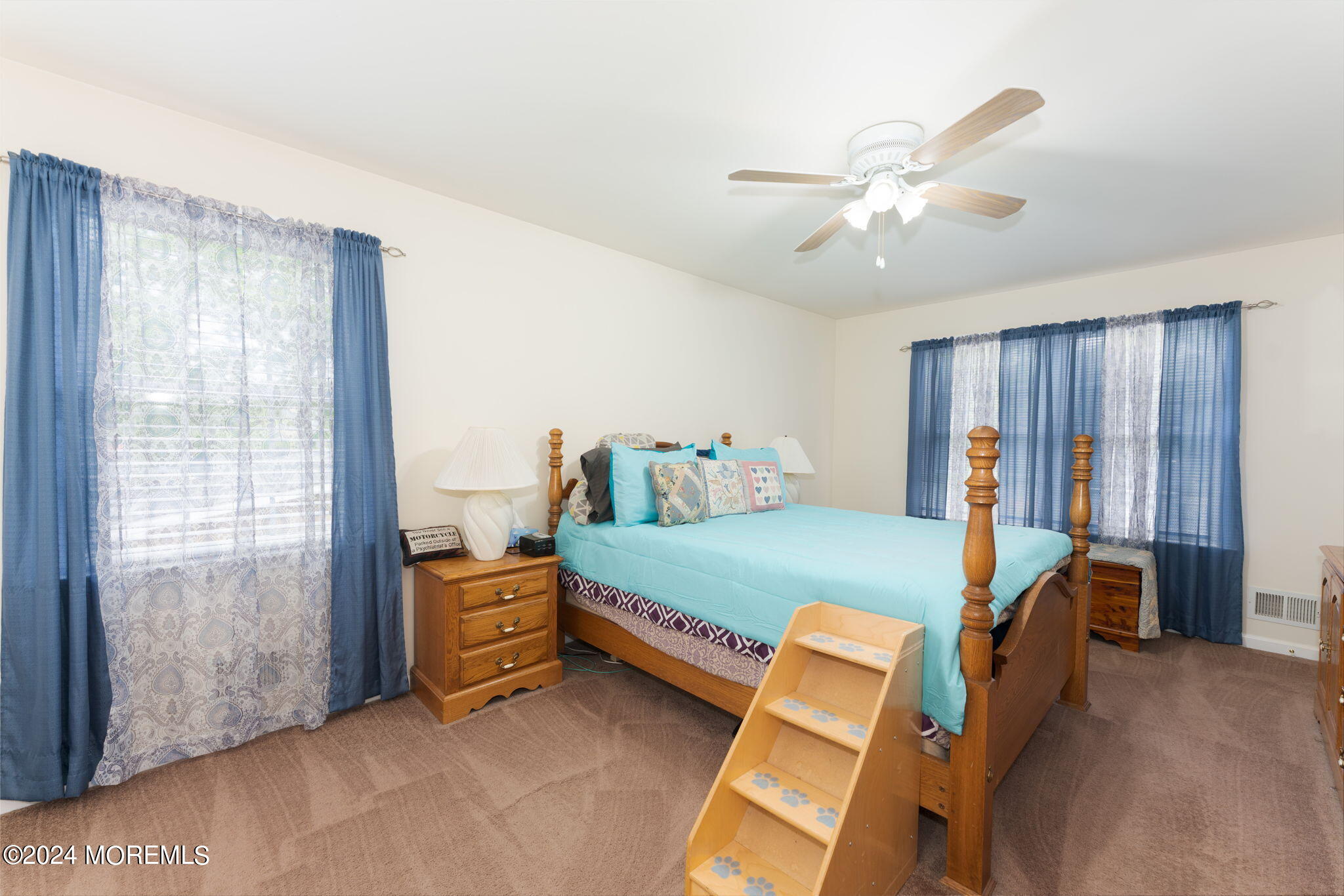 83 Gunning River Road Barnegat, NJ 08005 - Photo 13 of 24 a bedroom with a bed and a chandelier