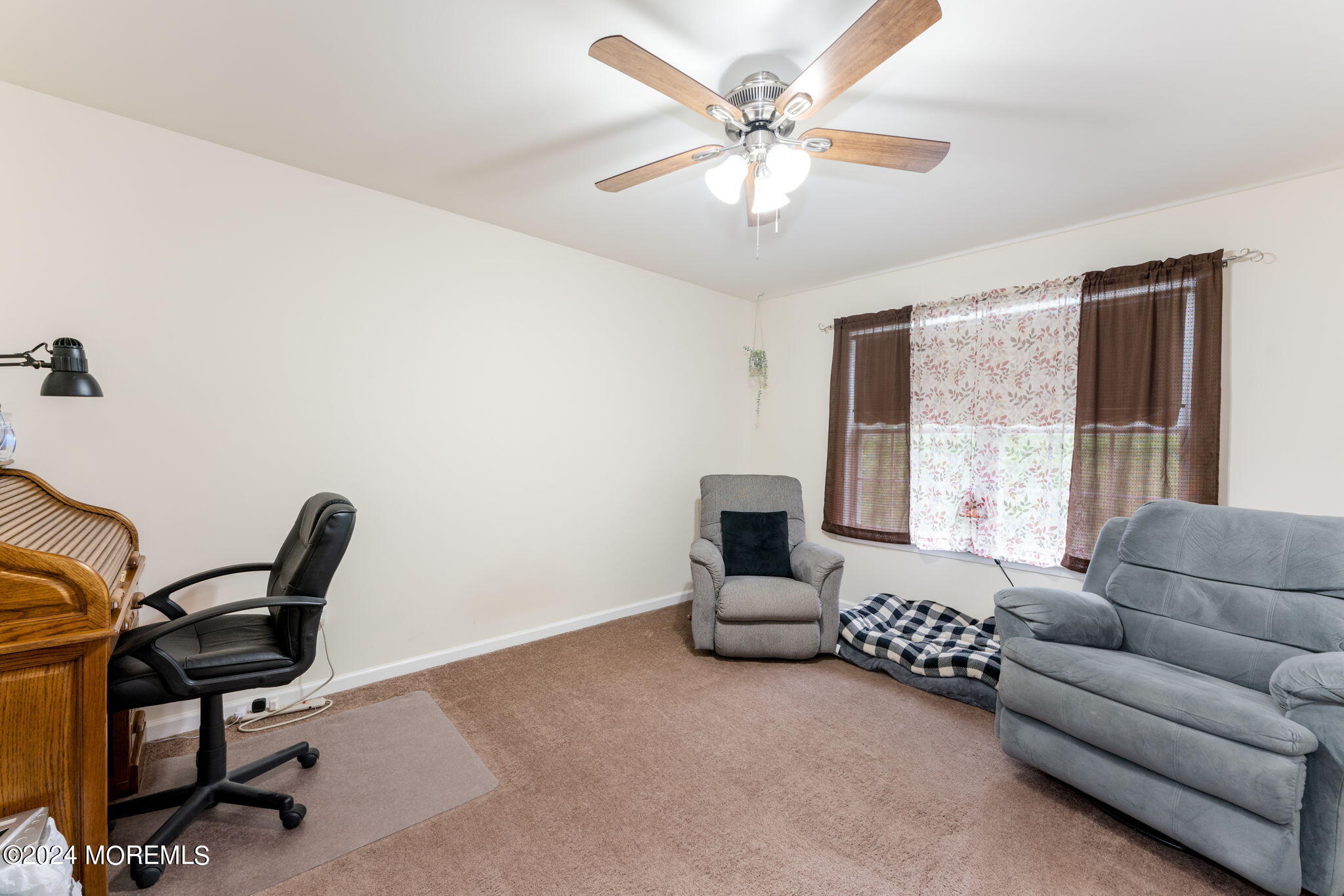 83 Gunning River Road Barnegat, NJ 08005 - Photo 17 of 24 a living room with furniture and a window