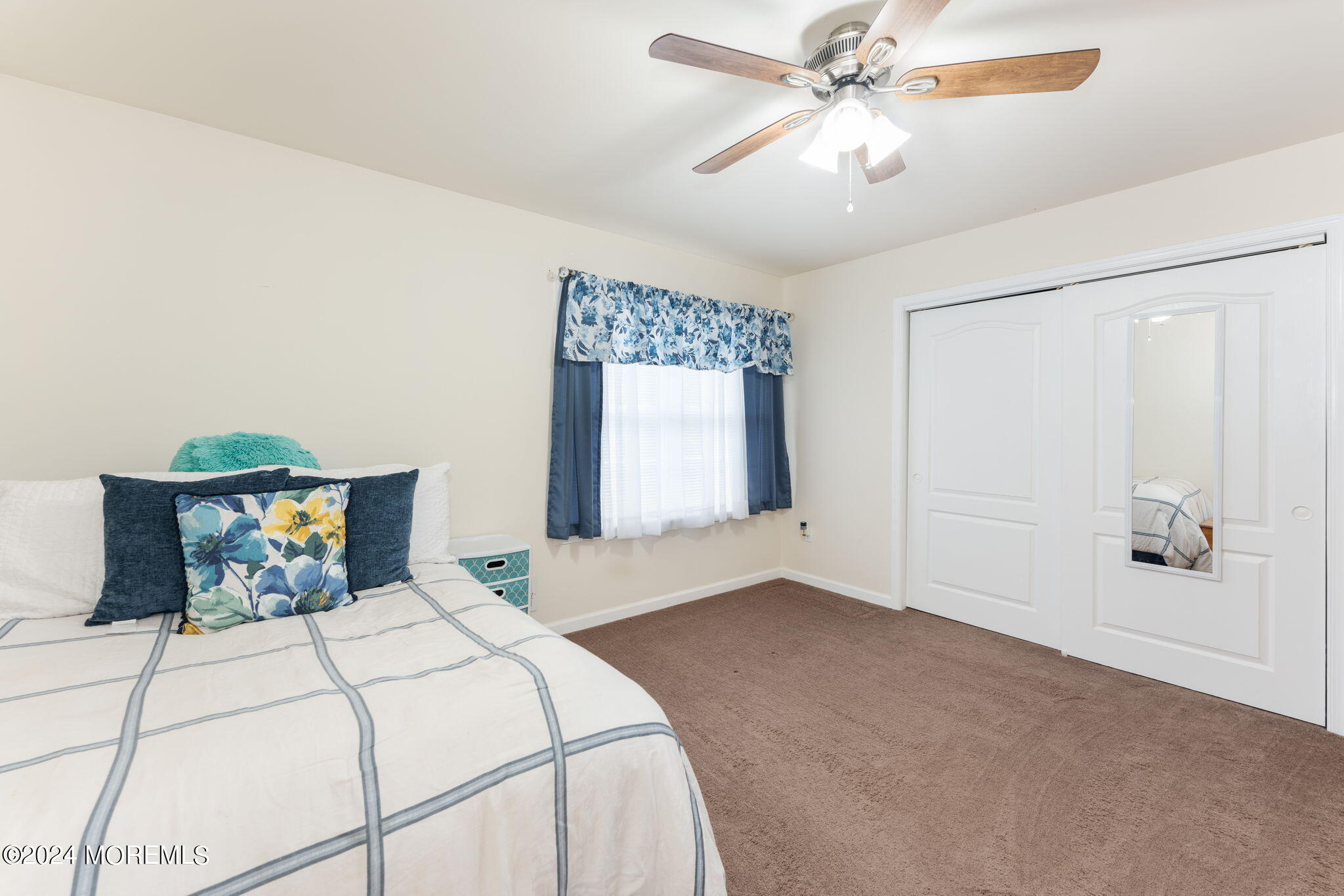83 Gunning River Road Barnegat, NJ 08005 - Photo 18 of 24 a bedroom with a bed and a chandelier