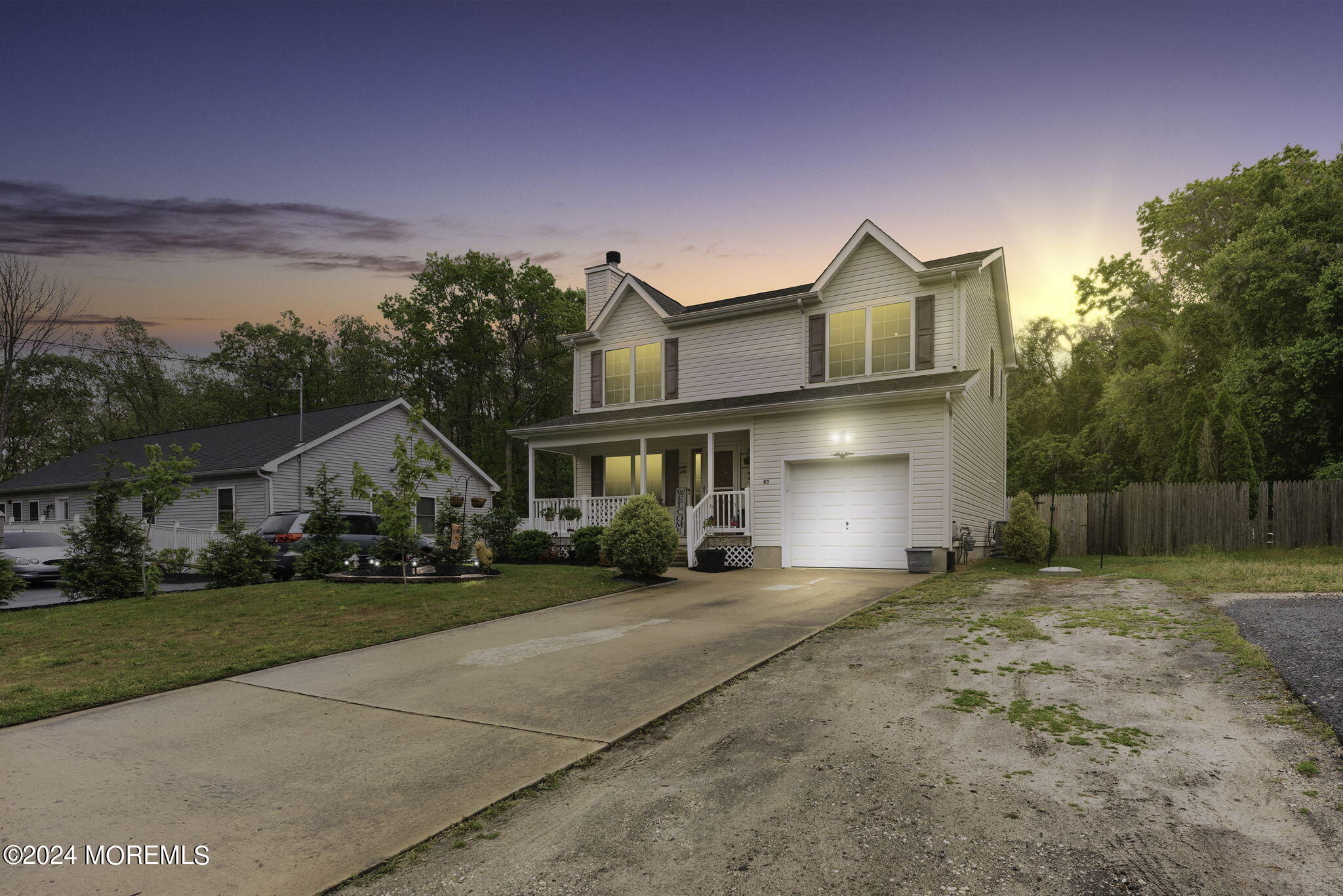 83 Gunning River Road Barnegat, NJ 08005 - Photo 2 of 24 a front view of a house with a yard and garage