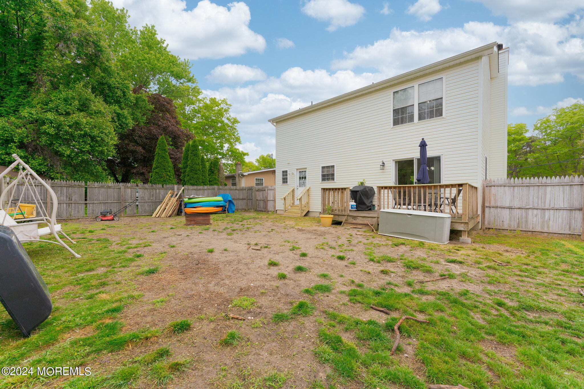 83 Gunning River Road Barnegat, NJ 08005 - Photo 23 of 24 a backyard of a house with table and chairs