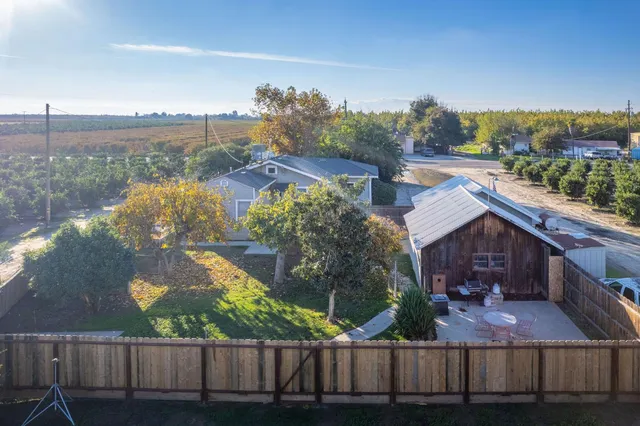 a view of houses with an outdoor space and lakeside