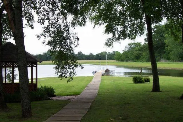 a view of a lake with a yard