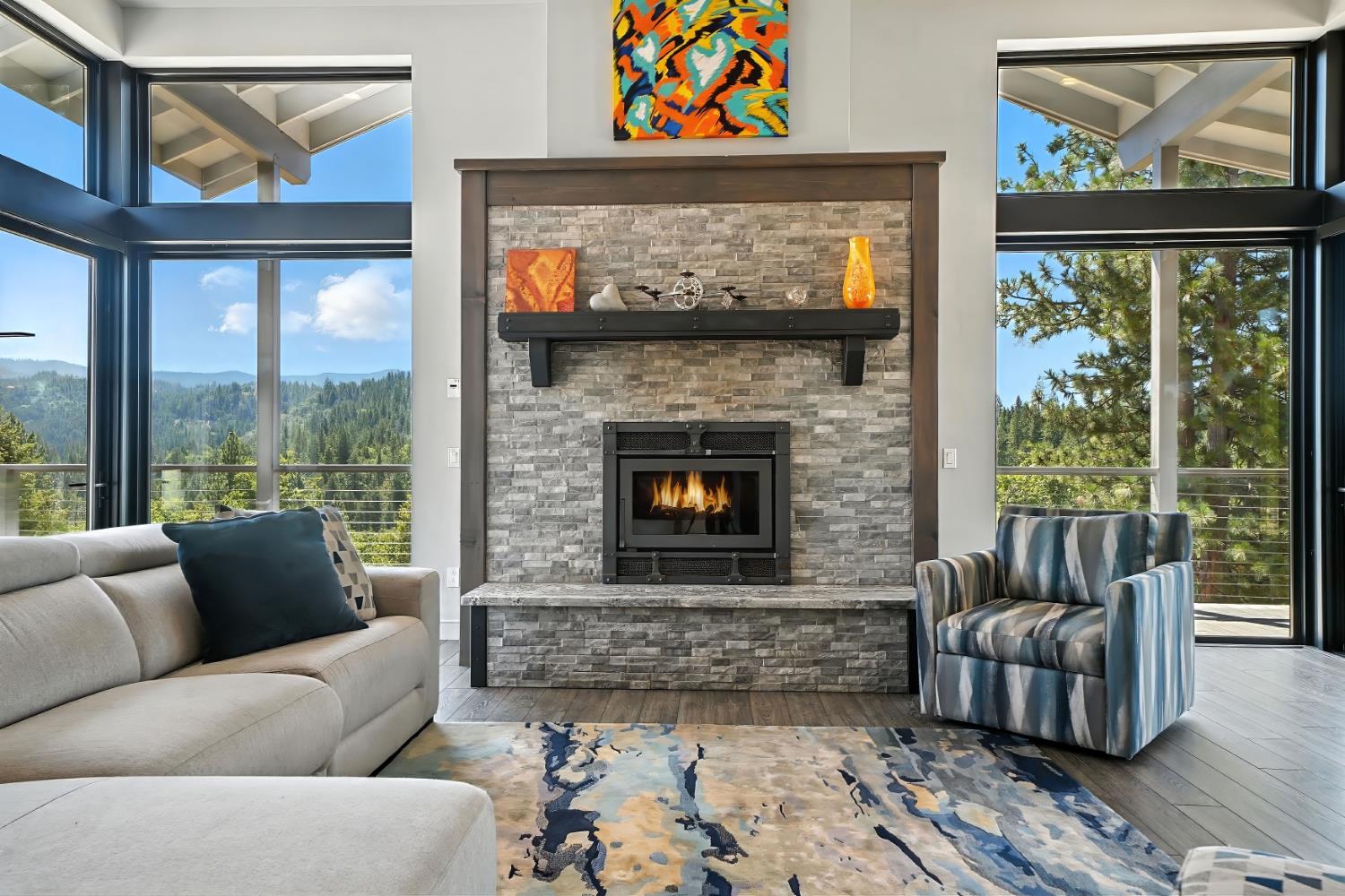 7401 Schaad Road Wilseyville, CA 95257 - Photo 12 of 76 a living room with furniture a large window and a fireplace