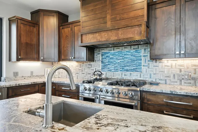 a bed room with a bed and painting on the wall