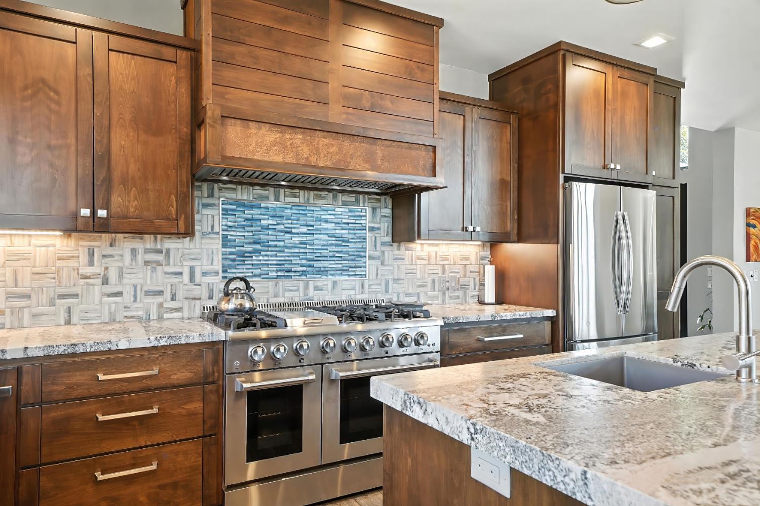 7401 Schaad Road Wilseyville, CA 95257 - Photo 29 of 76 a kitchen with stainless steel appliances granite countertop a sink stove and refrigerator