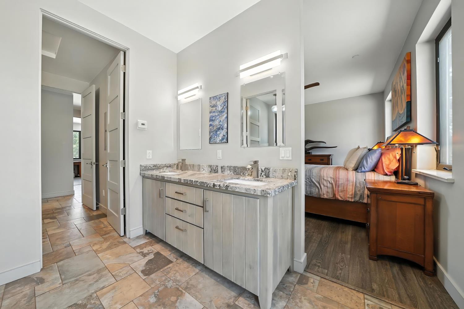 7401 Schaad Road Wilseyville, CA 95257 - Photo 38 of 76 a en suite bathroom with a double vanity sink and a mirror