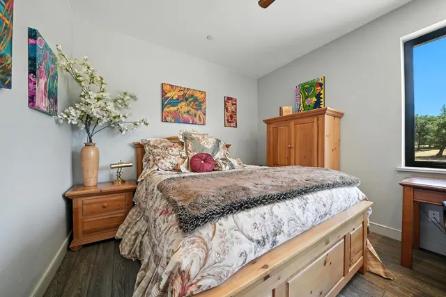 a view of a yard with trees in the background