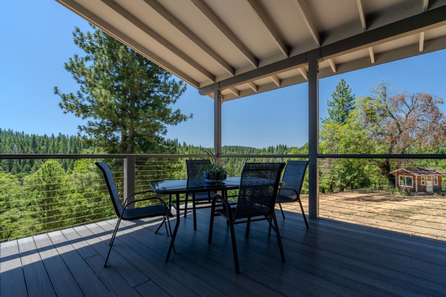 7401 Schaad Road Wilseyville, CA 95257 - Photo 46 of 76 a view of a balcony with chairs and wooden floor