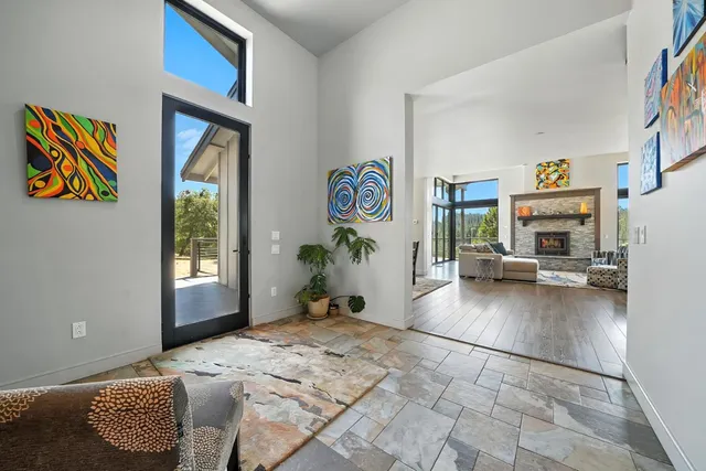 a view of a patio with a table and chairs