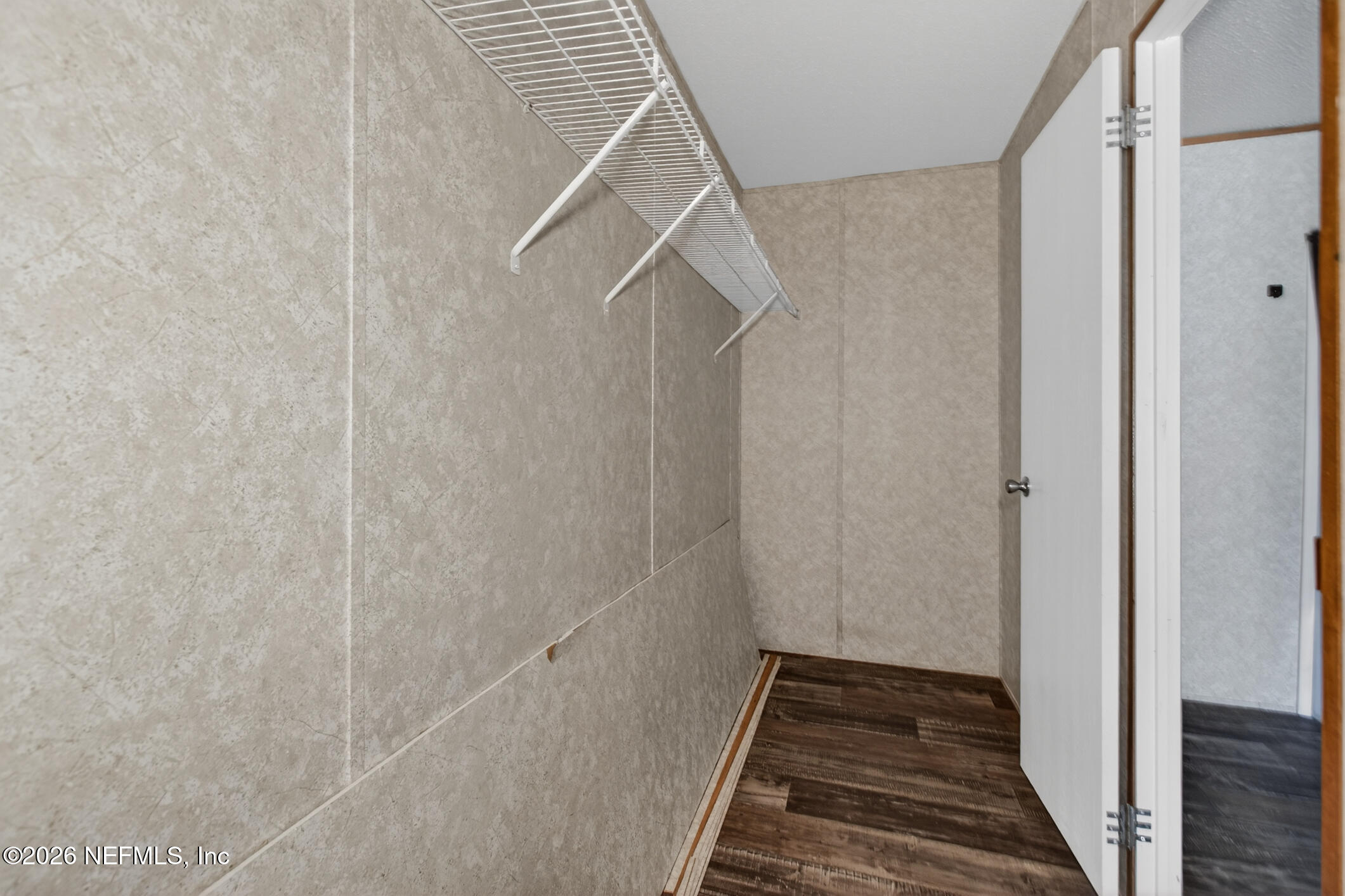 69 Azalea Avenue Middleburg, FL 32068 - Photo 20 of 41 a view of a hallway with wooden floor and staircase