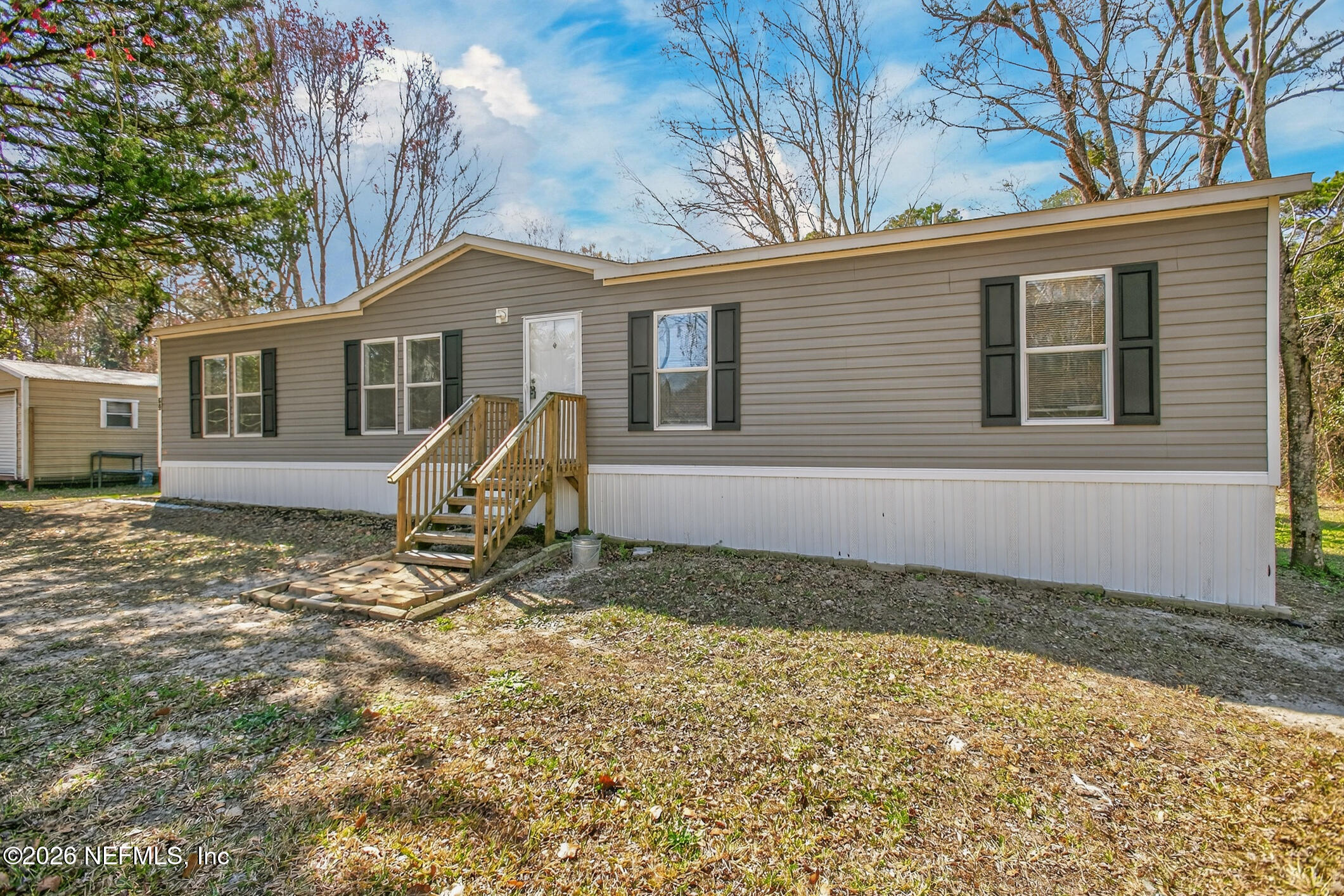 69 Azalea Avenue Middleburg, FL 32068 - Photo 2 of 41 a view of a house with a yard