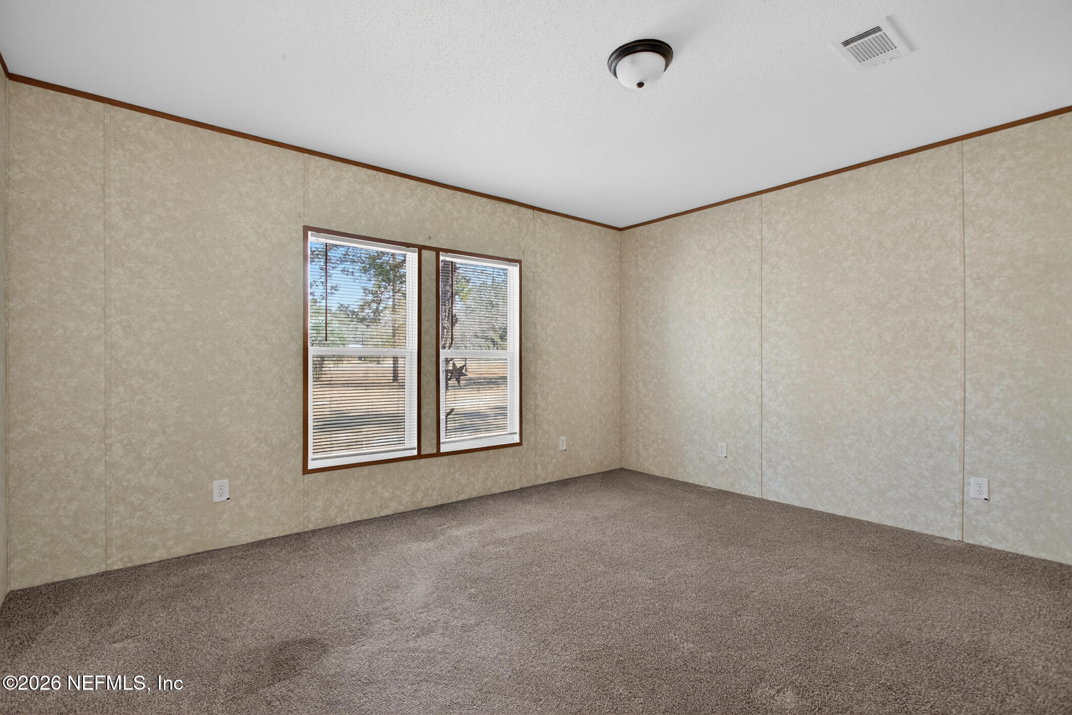 69 Azalea Avenue Middleburg, FL 32068 - Photo 21 of 41 a view of an empty room with a window