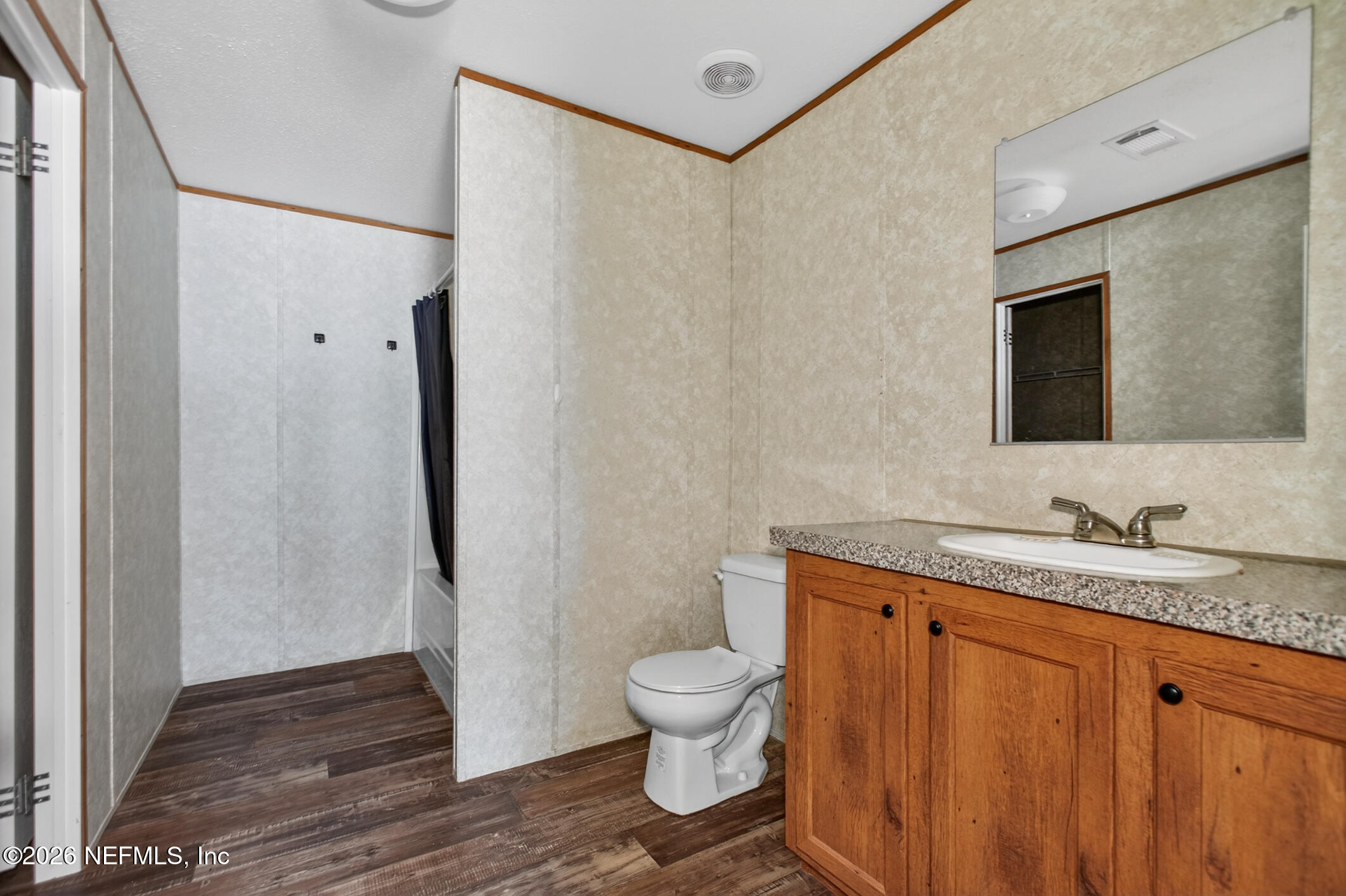 69 Azalea Avenue Middleburg, FL 32068 - Photo 28 of 41 a bathroom with a granite countertop sink toilet and shower