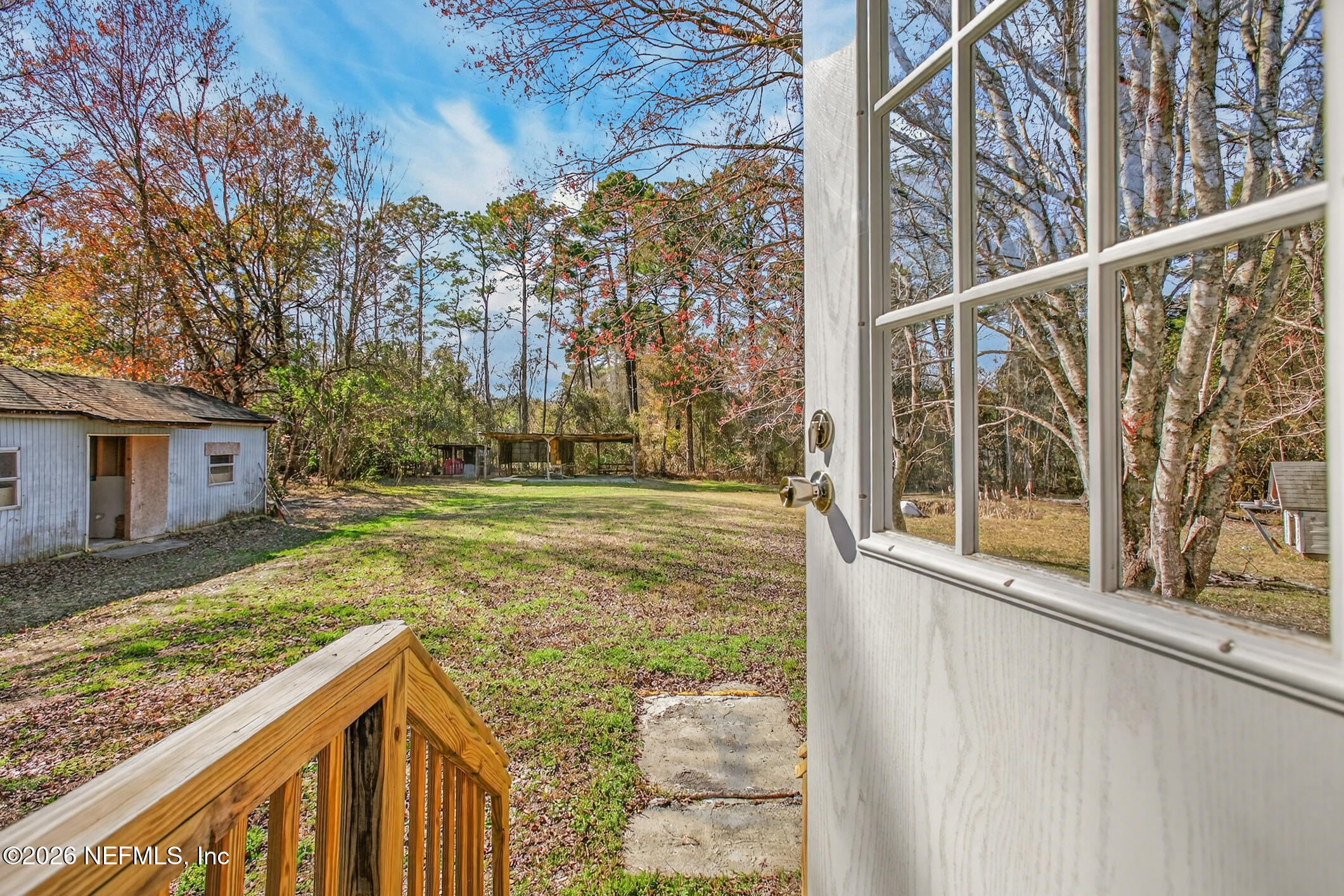 69 Azalea Avenue Middleburg, FL 32068 - Photo 30 of 41 a view of a house with a yard