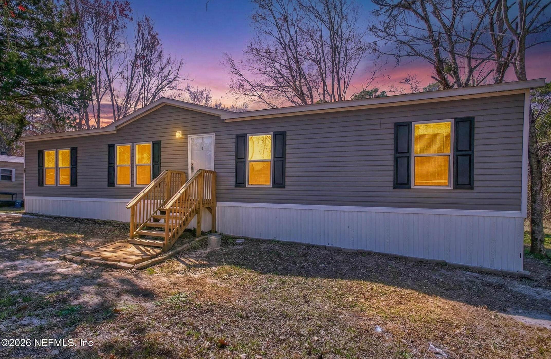 69 Azalea Avenue Middleburg, FL 32068 - Photo 31 of 41 a backyard of a house with barbeque oven table and chairs